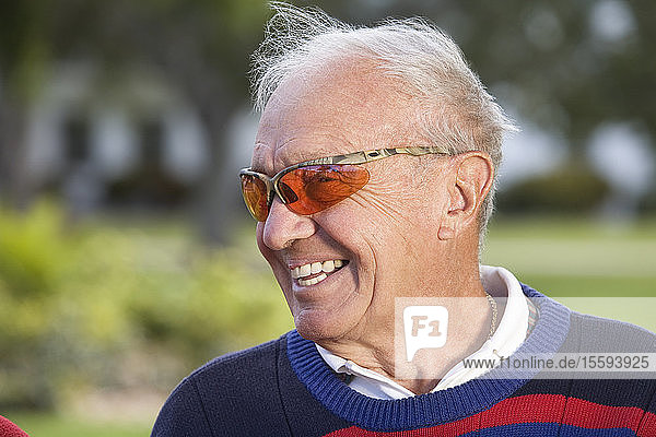View of a senior man smiling.