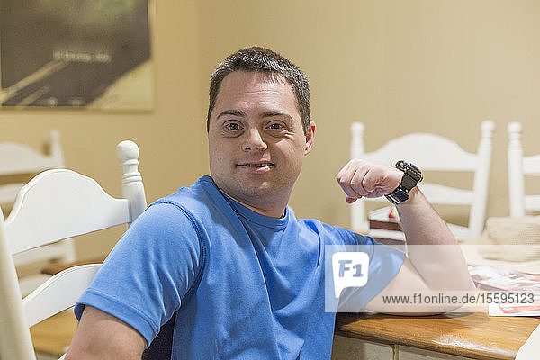 Portrait of a happy man with Down Syndrome