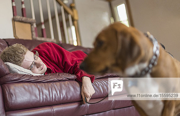 Boy with Anxiety Disorder and his therapy dog