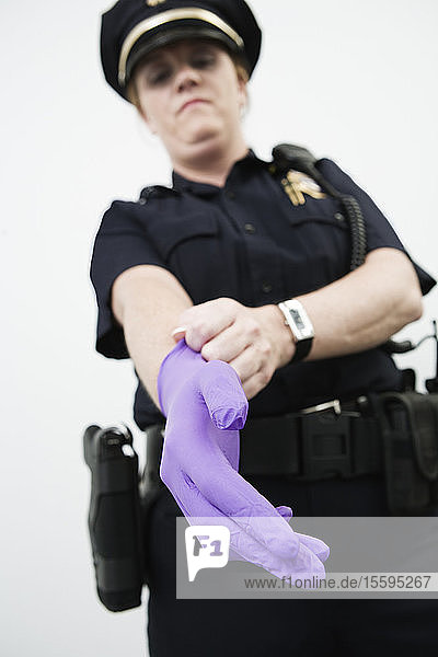 Woman police officer wearing a glove.