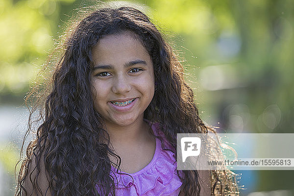 Portrait of happy Hispanic teen girl with braces