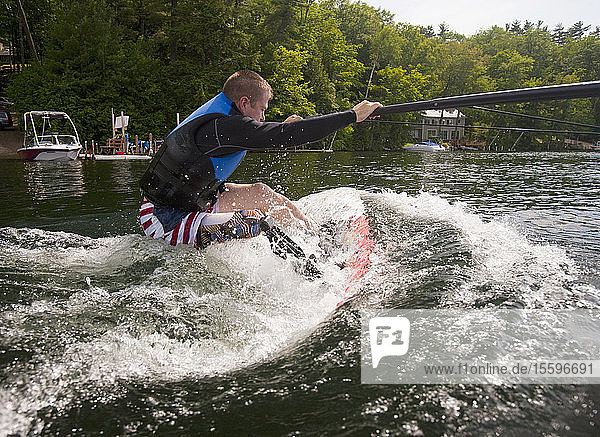 Athlete with an artificial leg water skiing