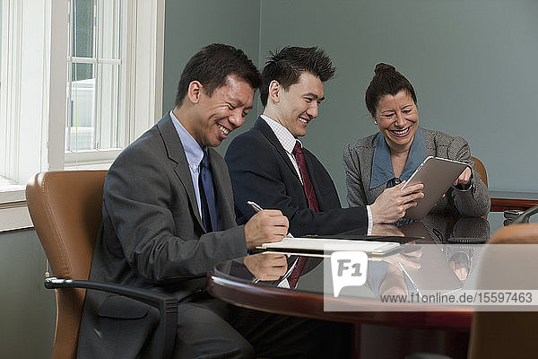 Three business executives in a board room