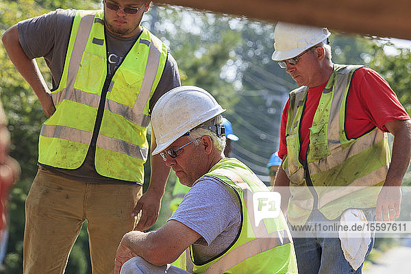 Constructions workers inspecting project