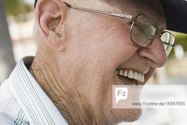 Close-up of a senior man laughing