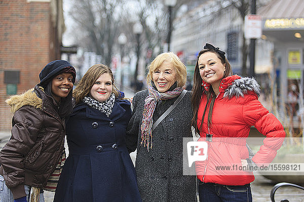 Portrait of four women smiling  Boston  Suffolk County  Massachusetts  USA