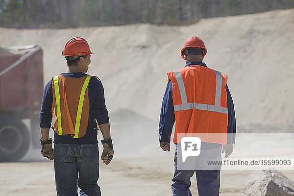 Two engineers at a gravel and asphalt plant