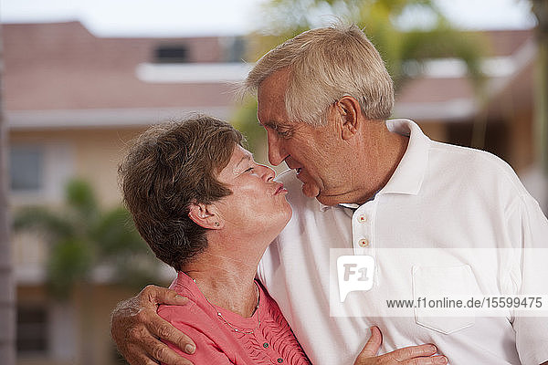 Senior couple kissing each other