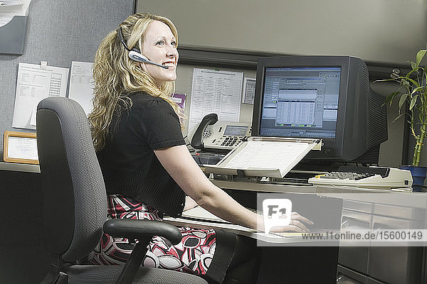 Female customer service representative working in an office