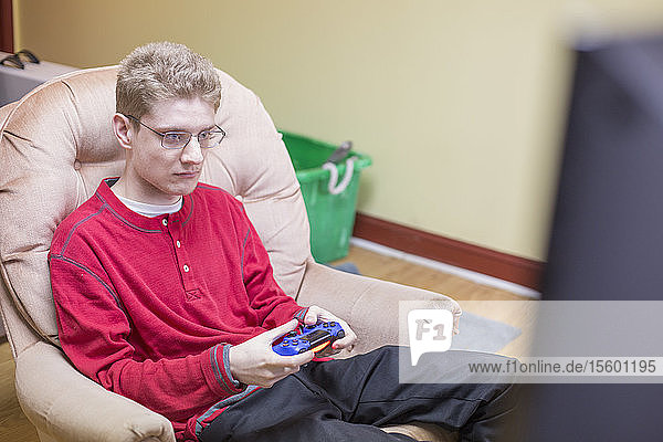 Boy with Anxiety Disorder playing video games