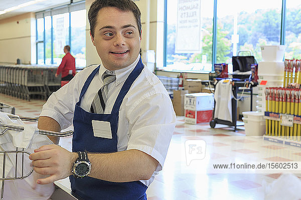 Man with Down Syndrome working at a grocery store