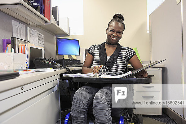Teen with Cerebral Palsy working in an office