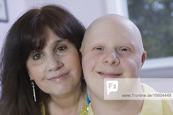 Portrait of a woman with her son with Down Syndrome