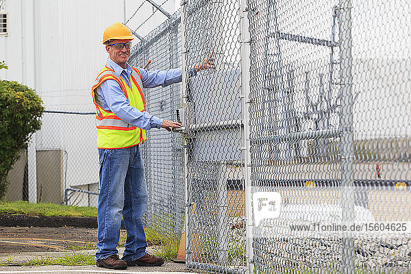 Electrical engineer using security system to enter electrical power plant