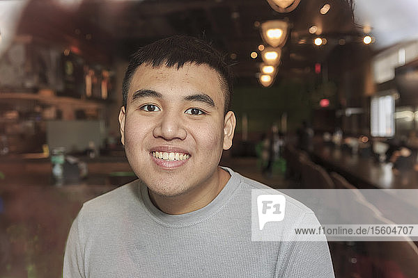 Young man with Autism working in a restaurant