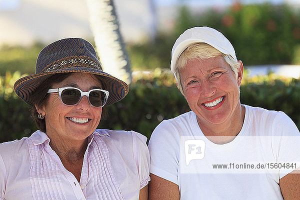 Portrait of two female friends smiling