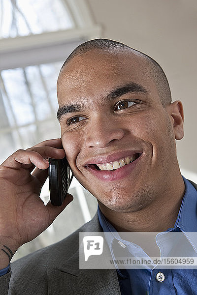 Hispanic businessman talking on a mobile phone