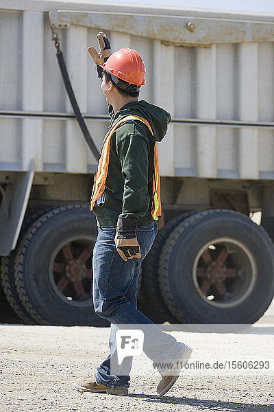 Engineer walking at a gravel and asphalt plant