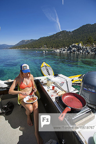 Woman Having Breakfast On Boat In Lake Tahoe  Neveda  Usa
