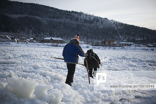 First people of the season crossing the Yukon River after freeze up in West Dawson  Yukon Territory  November 18  2014. Rafal Gerszak/Aurora Photos