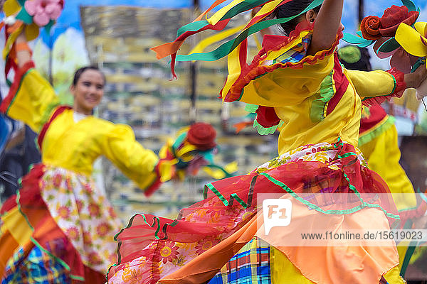 Women in colorful costumes from Tribu Ka-ing of Buga National High School  Municipality of Leon  Iloilo Province take part in 2015 Dinagyang Festival  Iloilo City  Western Visayas  Philippines