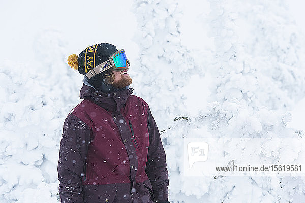 Portrait Of A Snowboarder During A Snow Storm