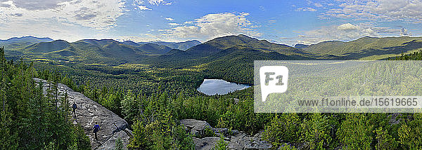 Distant View Of Hikers On The Summit Of Mount Jo In Adirondack Park