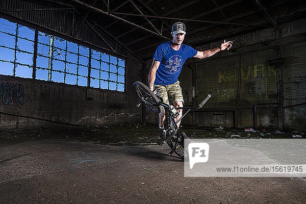 Chris Letchford riding BMX flatland in an old warehouse factory in Devonport  Tasmania.