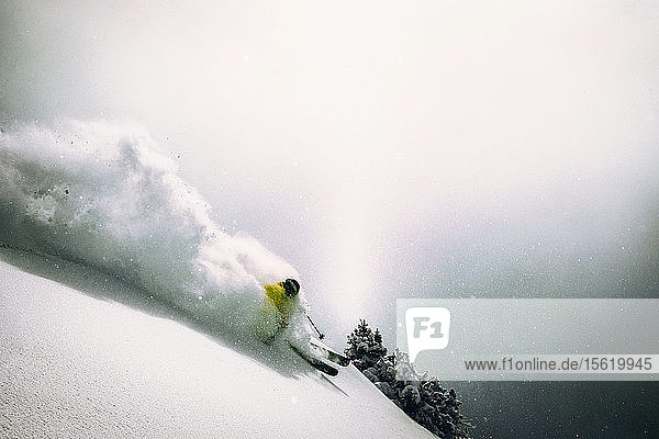 A man skiing powder at Snowbird Utah