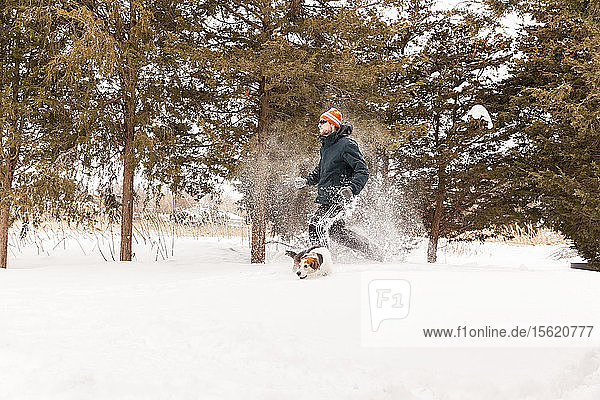 Snowshoe running with dog