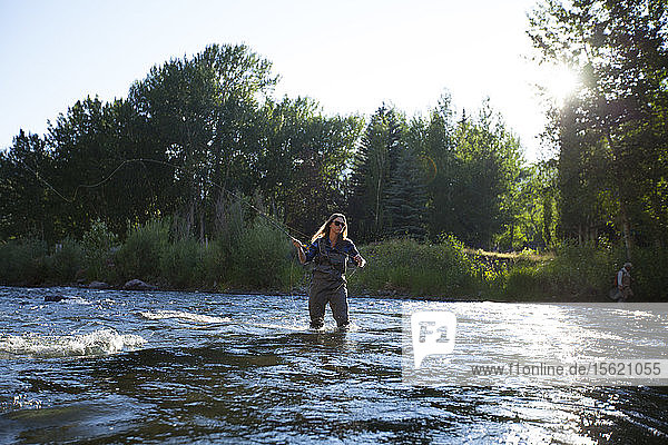 A Woman Fishing The Red Cliffs Area Of The Big Wood River Near Ketchum Idaho