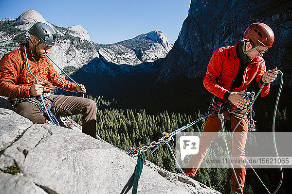 Climbers at the top of Pitch 3 on The Grack (5.6) in Yosemite Valley.