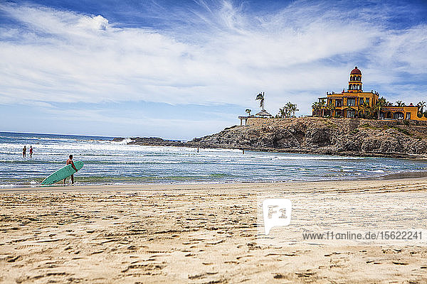 Tourists And Locals Swim And Surf In The Pacific Ocean At Los Cerritos  Todos Santos  Baja Sur  Mexico