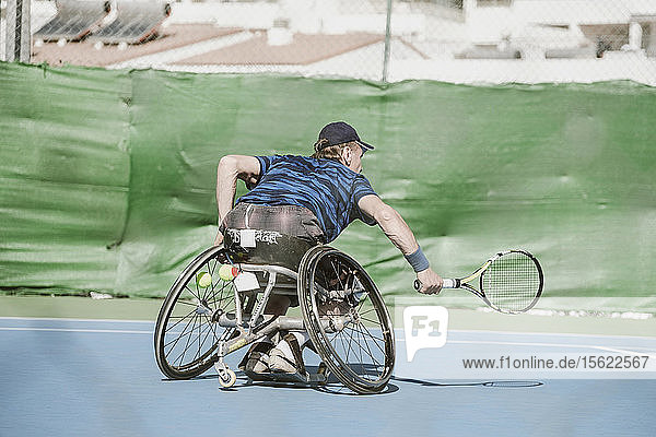 Mature Austrian paralympic tennis player playing on tennis court