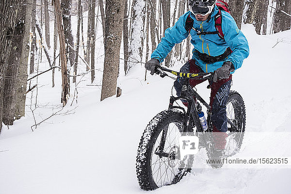 Winter riding on a fat tire bike in the woods of New Hampshire.