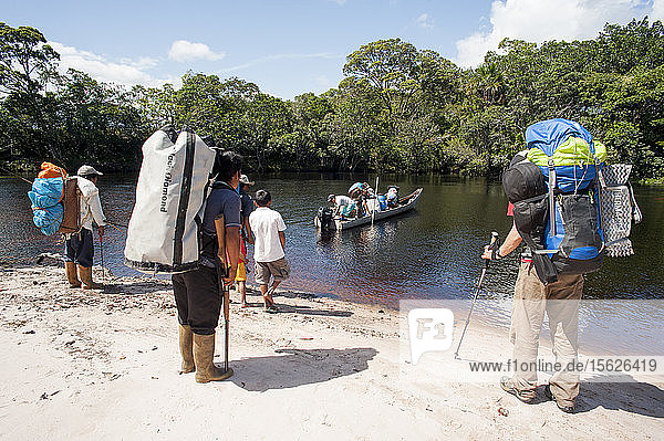 People Travelling In Pirogue On A River In Venezuela