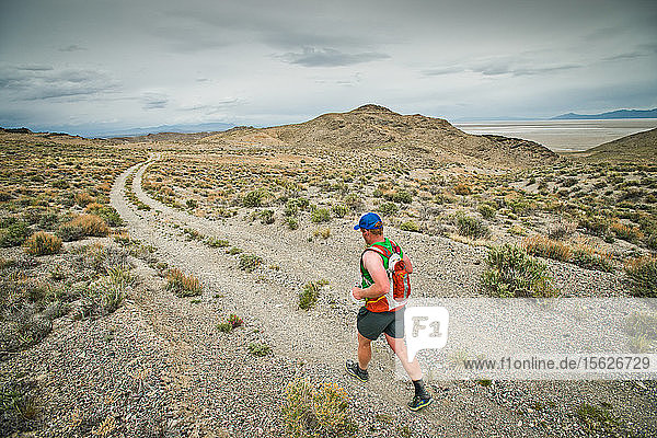 A competitor runs down a desolate trail during the Salt Flats 100 in Bonneville  Utah.