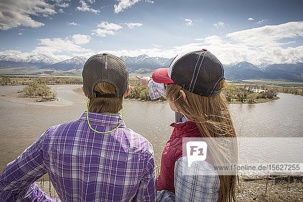 Two women look over the Yellowstone River in Montana.