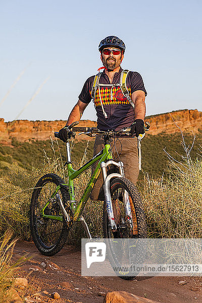 Mountain Biker rides the Blue Sky Trail while wearing a New Belgium Brewing bike jersey. He is near where Coyote Ridge Trail intersect the Blue Sky Trail  Fort Collins  Colorado.