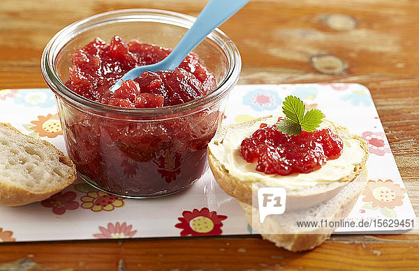 Strawberry and banana jam with buttered bread