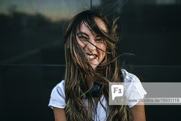 Laughing woman with hairs on her face  black background