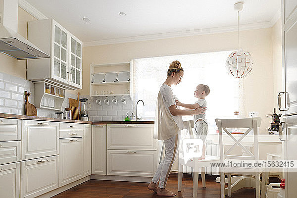 Mother with her little boy in the kitchen