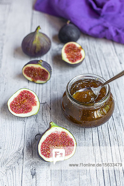 Sliced figs and jar of homemade fig jam