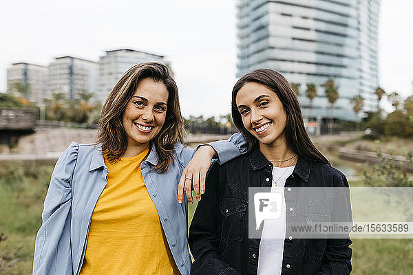 Portrait of two friends looking at camera