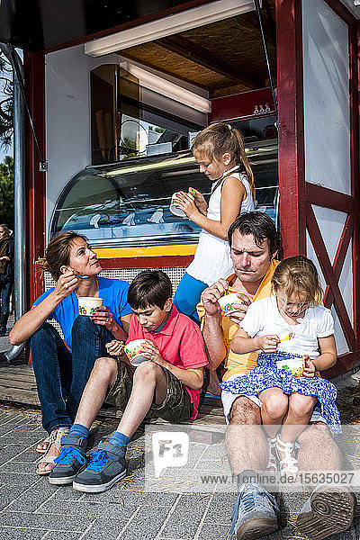 Family having ice cream at an ice cream parlor