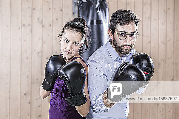 Portrait of man and woman with boxing gloves