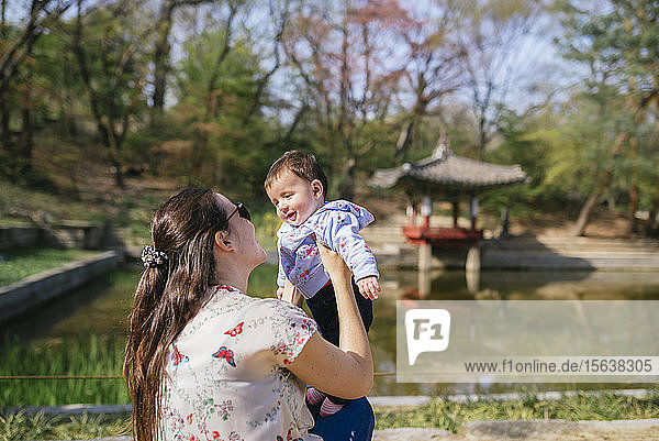 Mother and baby girl visiting the Secret Garden of Changdeokgung Palace  Seoul  South Korea
