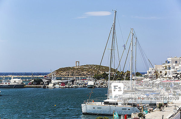 Boats and sailboats moored in the Chora harbour along the waterfront of the Mediterranean; Naxos Island  Cyclades  Greece