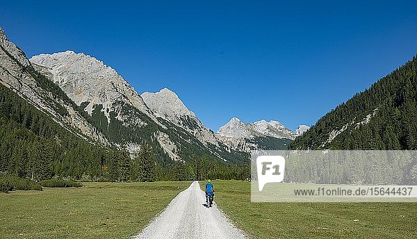Cyclist in the Karwendel valley  way to the Karwendelhaus  Tyrol  Austria  Europe