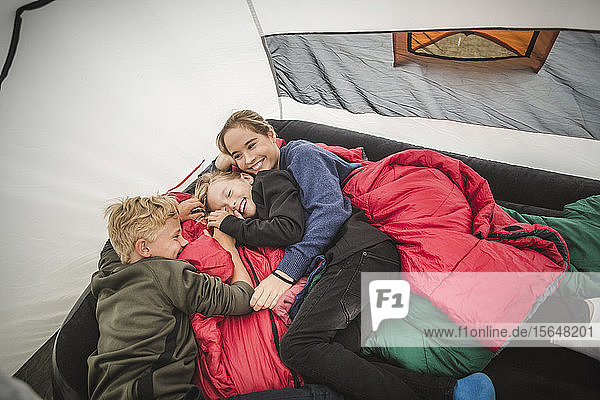 High angle view of children enjoying in tent